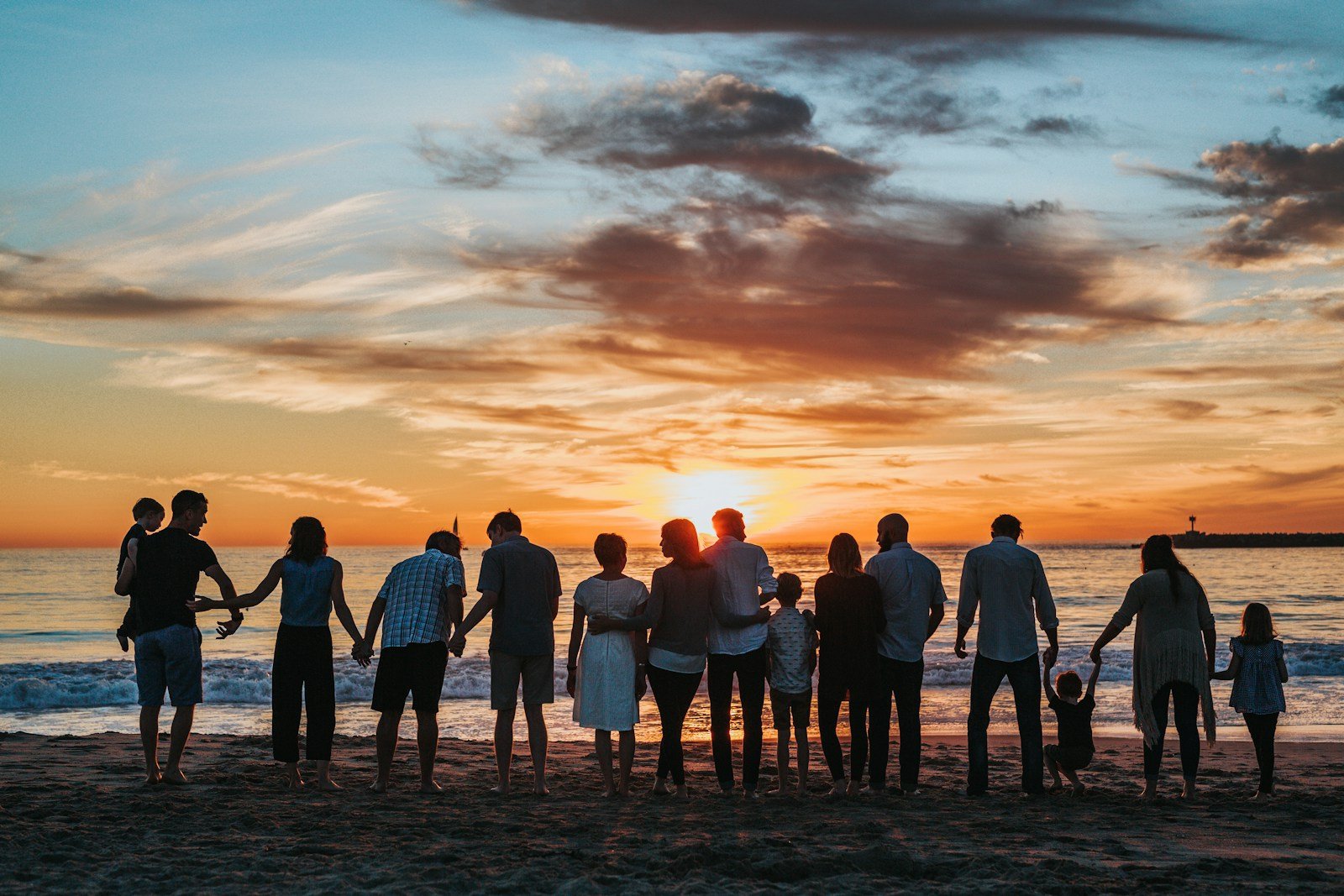 A family spending time together beside the ocean